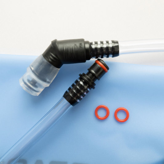 Black bladder connector with clear tube and red washers on a blue bladder