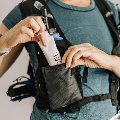 Person placing a gel packet into an Everpace vest pocket